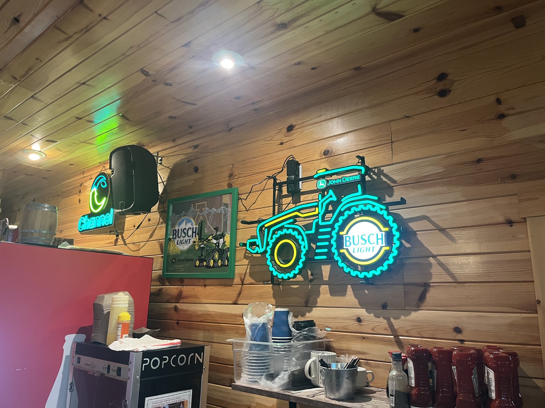 The bar at Double Barrel Steakhouse, neon signage and taps