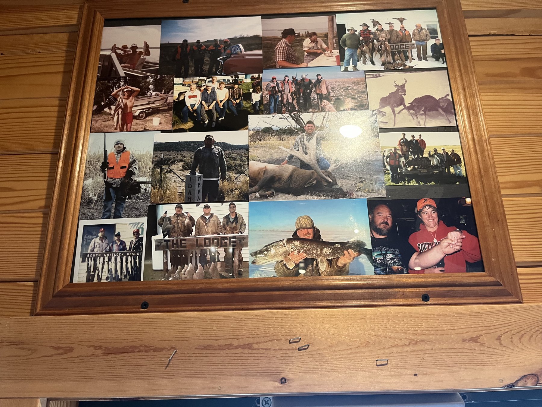 Wall of framed hunting photos at Double Barrel